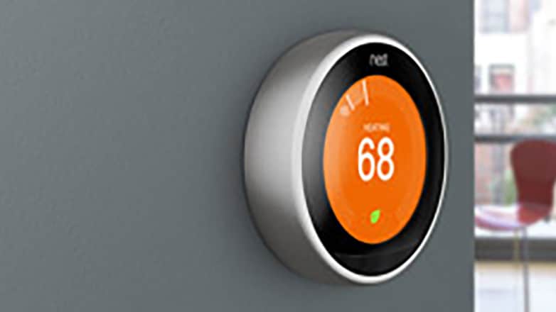 Smart thermostat displaying a temperature of 68°F.