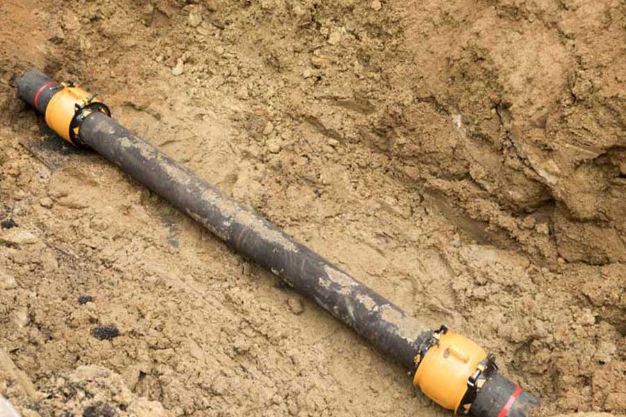 Underground gas line with new yellow couplings installed