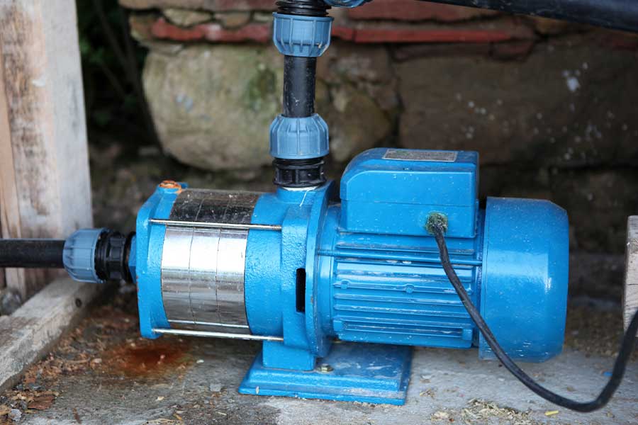 Blue water pump with black hose