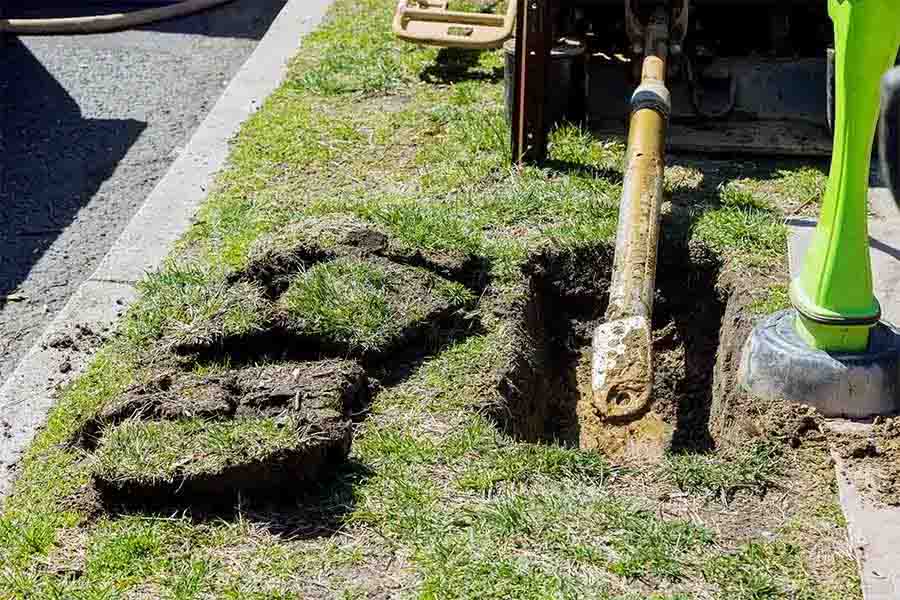 Excavated section of lawn during a main water line replacement in Nashville TN